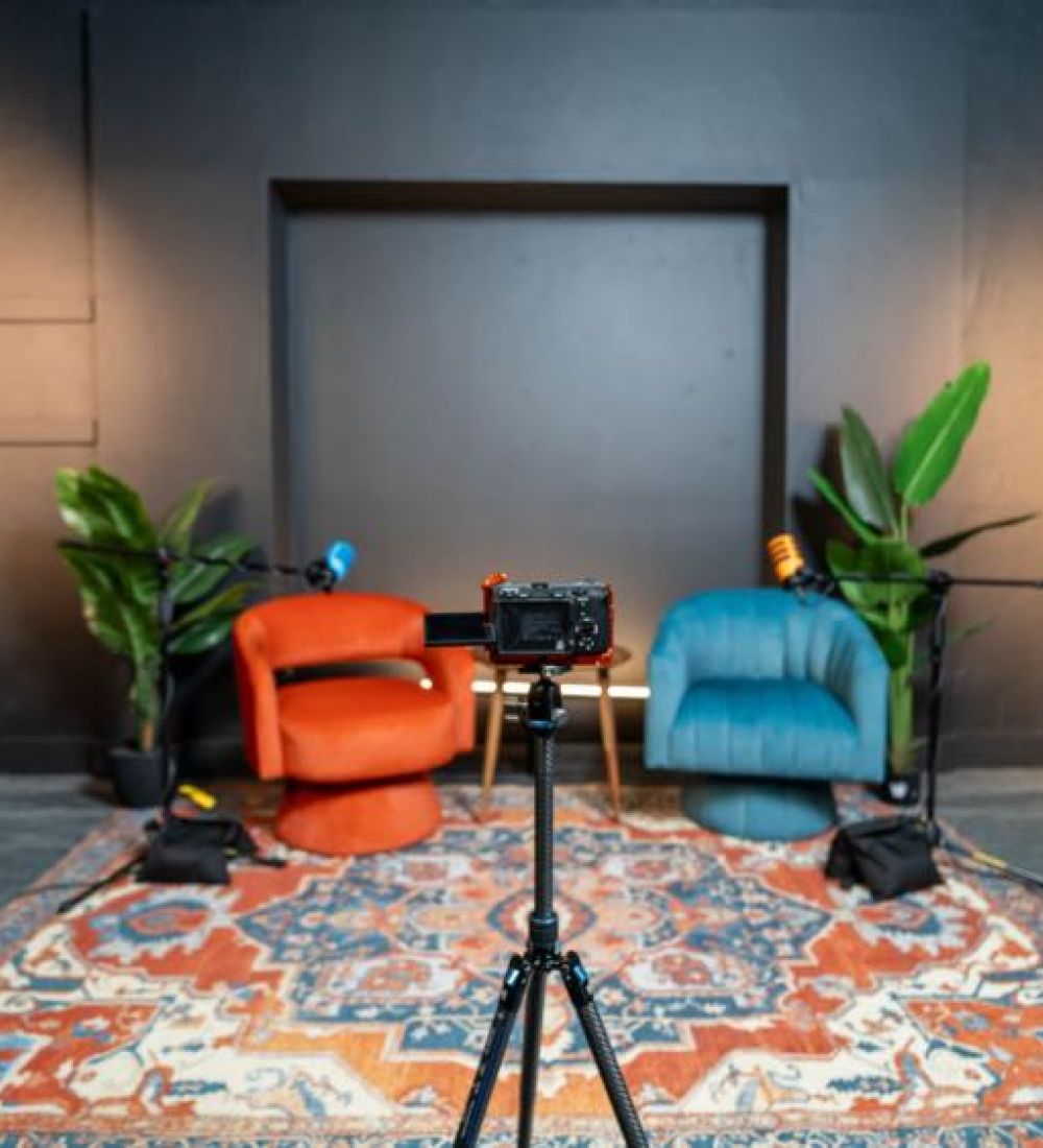 two sofas and a camera recording